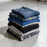 Folded garments from the mini adult pack