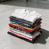 Folded garments from the mini kids pack